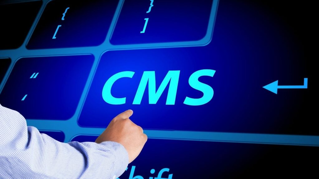 Hand pointing at "CMS," representing CMS platform selection.