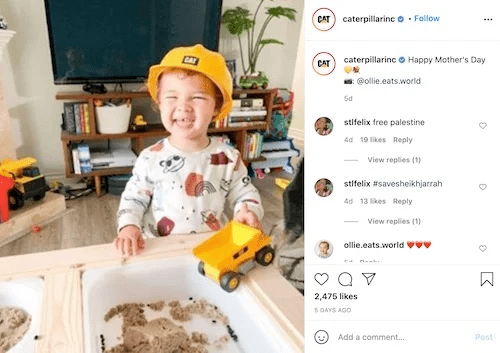 Caterpillar Instagram post showing a young child wearing a yellow toy hard hat and playing with a miniature yellow Cat dump truck. 